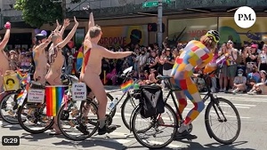 Naked men in front of a crowd with children at a Seattle pride event