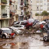 Wreckage of cars in an urban area resulting from the flooding